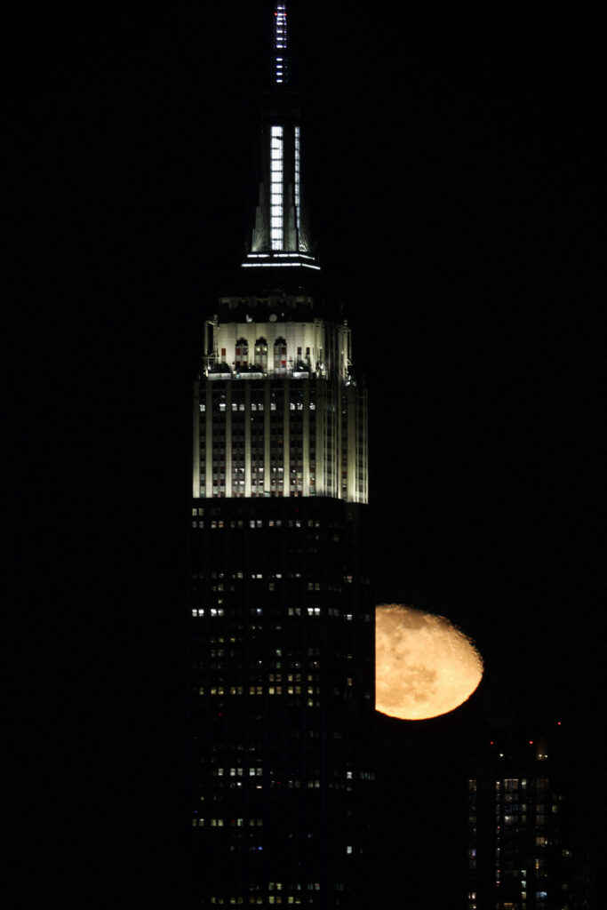 Moon rises over Manhattan of NYC