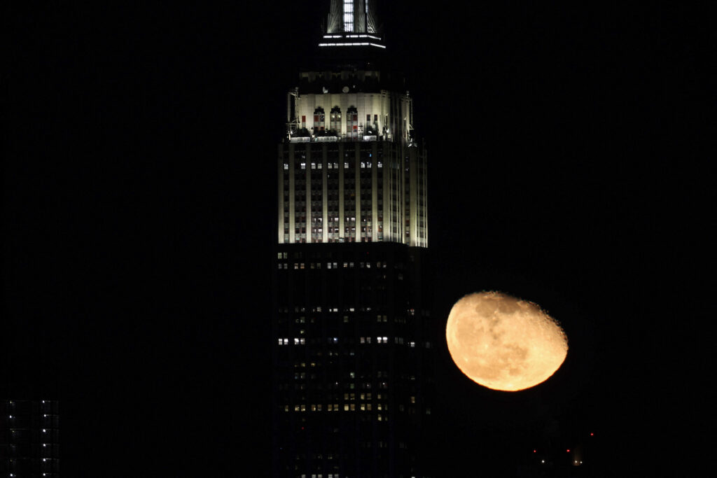 Moon rises over Manhattan of NYC