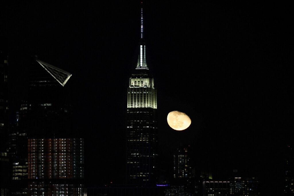 Moon rises over Manhattan of NYC