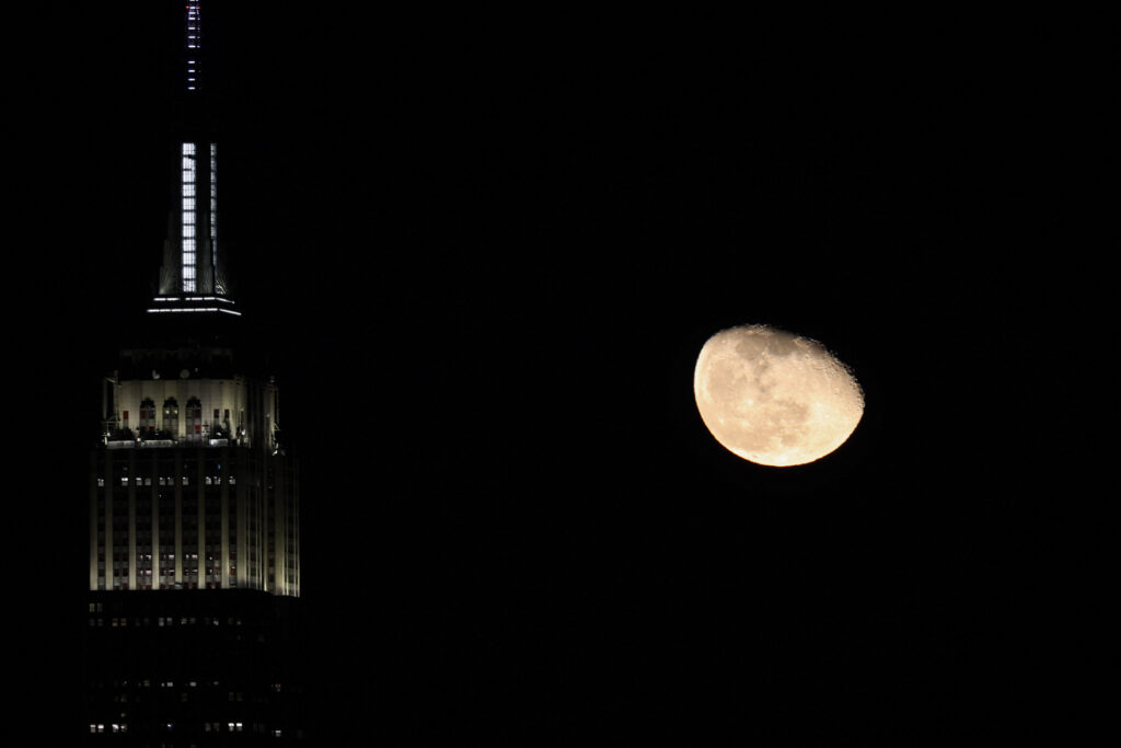 Moon rises over Manhattan of NYC