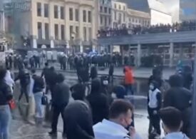 Zeci de poliţişti au fost răniţi în Belgia la un protest violent după arestarea unei femei de culoare (Video)