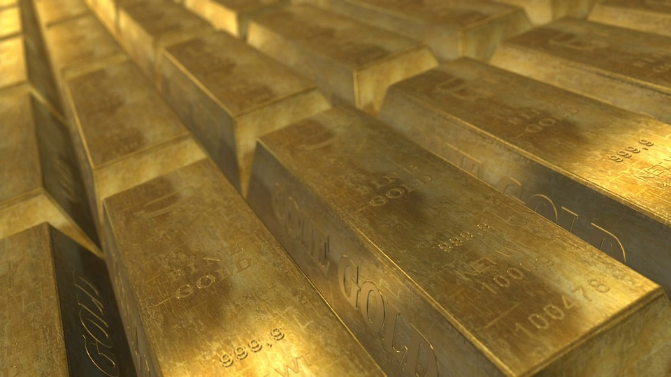 Aurul în perioade de criză: de ce prețurile scad înainte să crească