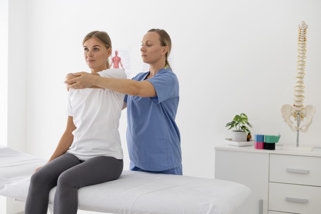 physiotherapist-helping-female-patient-her-clinic