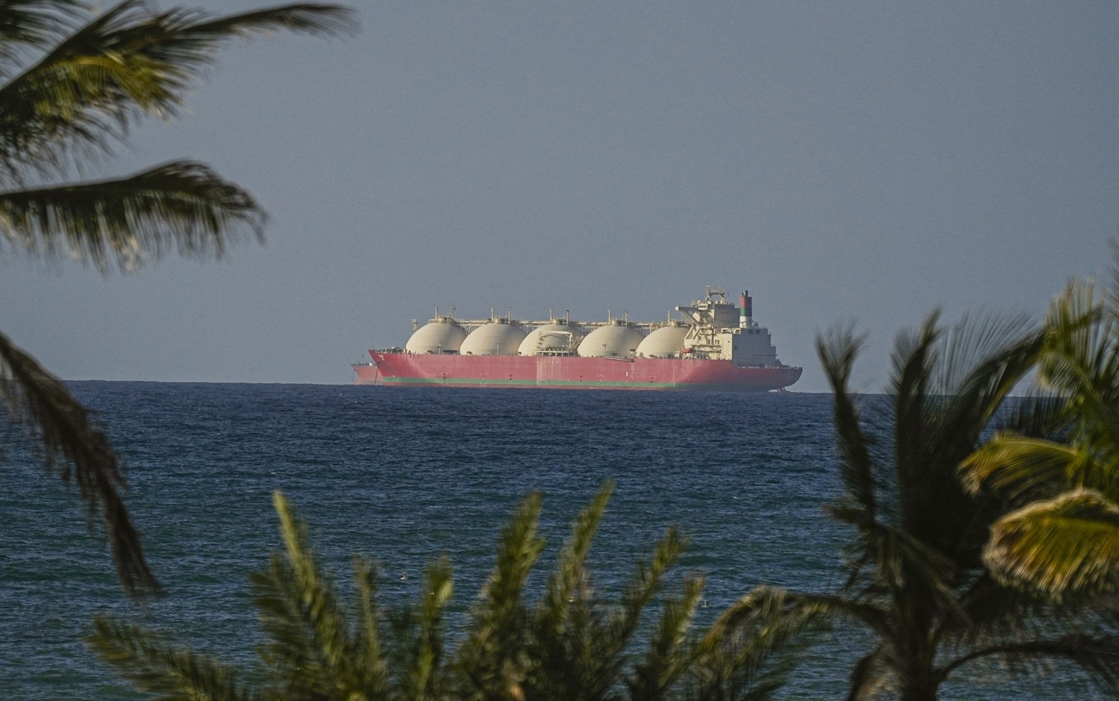 Iran war shifts global economy toward multipolar order as Iran gains strait leverage, non-OPEC producers boost output, and China cuts oil imports